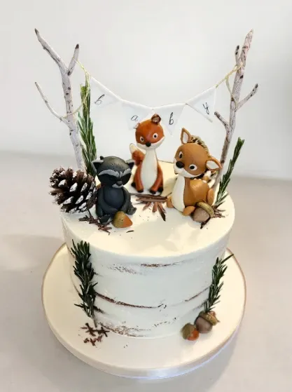 naked fondant cake with gumpaste forest animals