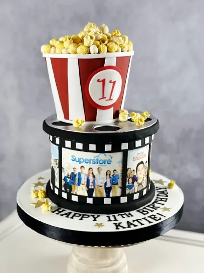 movie themed birthday cake with fondant popcorn topper