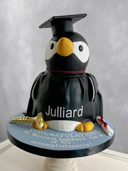 julliard graduation celebration cake of the penguin mascot